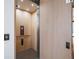 Modern home elevator featuring wood paneling, mirrored door, and integrated lighting, offering convenient access at 27 Boulder Cir, Breckenridge, CO 80424