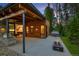 Beautiful outdoor patio with a grill, fire pit, hot tub, and wood ceiling with recessed lighting at 27 Boulder Cir, Breckenridge, CO 80424