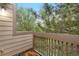 This cozy outdoor balcony space offers tranquil views of mature trees at 701 Harlan St # E53, Lakewood, CO 80214