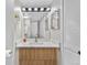 Bright bathroom featuring updated vanity, modern fixtures, and sleek mirror at 701 Harlan St # E53, Lakewood, CO 80214