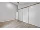 Spacious bedroom with large closet and hardwood floors at 701 Harlan St # E53, Lakewood, CO 80214