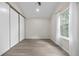 Well-lit bedroom with ample natural light, modern floors, and a spacious closet for storage at 701 Harlan St # E53, Lakewood, CO 80214