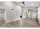 Bright bedroom featuring vaulted ceiling, modern flooring, and mirrored closet, offering spaciousness at 701 Harlan St # E53, Lakewood, CO 80214