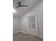 Cozy bedroom with neutral paint, ceiling fan, and natural light at 701 Harlan St # E53, Lakewood, CO 80214