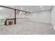 Bright bonus room with skylights, soft carpet, and fresh neutral paint, providing a versatile living space at 701 Harlan St # E53, Lakewood, CO 80214
