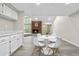 A bright dining space adjoins the kitchen and living areas, providing an open, inclusive layout at 701 Harlan St # E53, Lakewood, CO 80214