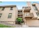 Inviting multi-level condo showcases private balconies, a well-kept facade, and convenient garage access at 701 Harlan St # E53, Lakewood, CO 80214