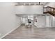 Open floor plan connecting a dining area to the staircase leading upstairs at 701 Harlan St # E53, Lakewood, CO 80214
