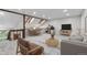 Staged living room with skylights, contemporary furnishings, and comfortable seating at 701 Harlan St # E53, Lakewood, CO 80214