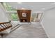 Stylish living room showcases a wooden accent wall with fireplace and a large window with outside views at 701 Harlan St # E53, Lakewood, CO 80214