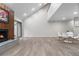 The living room is spacious and bright, with a fireplace and an open concept to the dining area at 701 Harlan St # E53, Lakewood, CO 80214