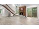 Cozy living area boasts a wood-burning fireplace, staircase, and sliding glass doors leading to a balcony at 701 Harlan St # E53, Lakewood, CO 80214