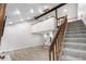 Cozy living room featuring a staircase and loft, perfect for relaxing and entertaining guests at 701 Harlan St # E53, Lakewood, CO 80214