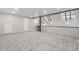 Expansive carpeted loft with skylights, and neutral colors creating a bright and airy living space at 701 Harlan St # E53, Lakewood, CO 80214