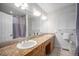 Spacious bathroom with double sinks, granite countertop, and plenty of cabinet storage at 20 W Ranch Trl, Morrison, CO 80465