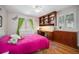 Charming bedroom with built-in desk and shelving providing functional space for work or hobbies at 20 W Ranch Trl, Morrison, CO 80465