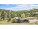 Scenic exterior view of a house with a patio and mountain views at 20 W Ranch Trl, Morrison, CO 80465