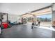 Spacious garage gym with rubber floors, great views, and lots of natural light perfect for exercising at 20 W Ranch Trl, Morrison, CO 80465