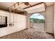 A spacious horse barn interior with a sliding door providing access to a horse enclosure at 20 W Ranch Trl, Morrison, CO 80465