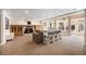 Open-concept living room with fireplace and bar seating, ideal for entertaining guests at 20 W Ranch Trl, Morrison, CO 80465