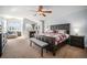 Spacious bedroom with fireplace, sitting area, and large bed for comfortable living at 20 W Ranch Trl, Morrison, CO 80465