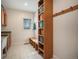 Organized mudroom with built-in bench, shelving, and hooks for convenient storage at 20 W Ranch Trl, Morrison, CO 80465