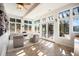 Bright sunroom with tile floors, lots of windows, and natural light perfect for relaxing at 20 W Ranch Trl, Morrison, CO 80465