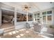 Bright sunroom with tile floors, lots of windows, and natural light perfect for relaxing at 20 W Ranch Trl, Morrison, CO 80465