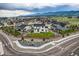 This house is located in a neighborhood, with mountains in the background and xeriscaped front yards at 16881 Roaming Elk Dr, Monument, CO 80132
