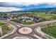 This house is located in a neighborhood, with mountains in the background and xeriscaped front yards at 16881 Roaming Elk Dr, Monument, CO 80132