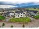 The property has a lawn, surrounded by a wooden fence, and views of the mountains in the background at 16881 Roaming Elk Dr, Monument, CO 80132