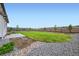 Expansive backyard featuring a well-maintained lawn and a wood fence at 16881 Roaming Elk Dr, Monument, CO 80132