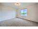 Bedroom with a window offering natural light and a carpeted floor at 16881 Roaming Elk Dr, Monument, CO 80132
