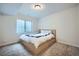 Cozy bedroom with neutral carpet, egress window, and minimalist design at 16881 Roaming Elk Dr, Monument, CO 80132