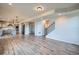 Spacious living area flowing into a modern kitchen, featuring beautiful laminate floors at 16881 Roaming Elk Dr, Monument, CO 80132