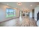 Open-concept living space with views of the outside, seamlessly flowing into the kitchen at 16881 Roaming Elk Dr, Monument, CO 80132