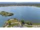 Aerial view showcasing a lake with walking paths, lush greenery, and ample parking space with stunning mountain view at 2616 Utica St, Denver, CO 80212