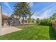 Expansive backyard featuring a well-manicured lawn, mature trees, and plenty of space for outdoor activities at 2616 Utica St, Denver, CO 80212