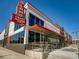 Modern Alamo Draft House Cinema exterior with vibrant signage and inviting outdoor seating area at 2616 Utica St, Denver, CO 80212