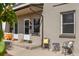 Charming front porch with a cozy seating area, decorative plants, and a welcoming entrance at 2616 Utica St, Denver, CO 80212