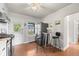 Bright kitchen featuring modern appliances, a breakfast table, and plenty of counter space for cooking and entertaining at 2616 Utica St, Denver, CO 80212