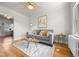 Bright living room featuring hardwood floors, modern décor, and plenty of natural light at 2616 Utica St, Denver, CO 80212