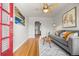 Cozy living room featuring hardwood floors, stylish furniture, and abundant natural light, creating a welcoming atmosphere at 2616 Utica St, Denver, CO 80212