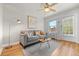 Inviting living room with hardwood floors, neutral décor, and lots of natural light, creating a warm and welcoming space at 2616 Utica St, Denver, CO 80212