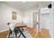 Bright office with a desk, chair, hardwood floors, and closet for storage at 2616 Utica St, Denver, CO 80212