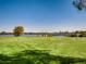 Park view of Sloan's Lake with green grass and a foot bridge to the skyline at 2616 Utica St, Denver, CO 80212