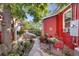 Cozy patio with seating area and mature tree in the backyard at 403 W 3Rd Ave, Denver, CO 80223