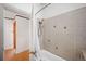 Bathroom with shower/tub, and view of hallway at 403 W 3Rd Ave, Denver, CO 80223