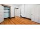 Bedroom with hardwood floors, closet, and neutral walls at 403 W 3Rd Ave, Denver, CO 80223