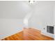 Charming bedroom with hardwood floors and sloped ceilings at 403 W 3Rd Ave, Denver, CO 80223